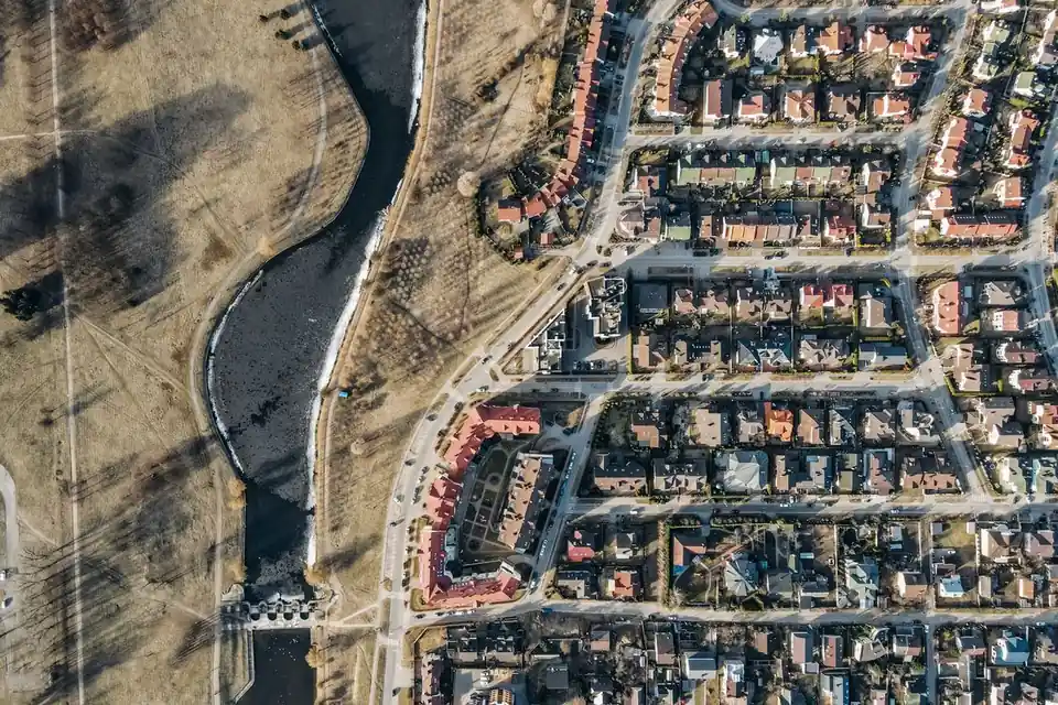 Aerial view of riverside homes and trees
