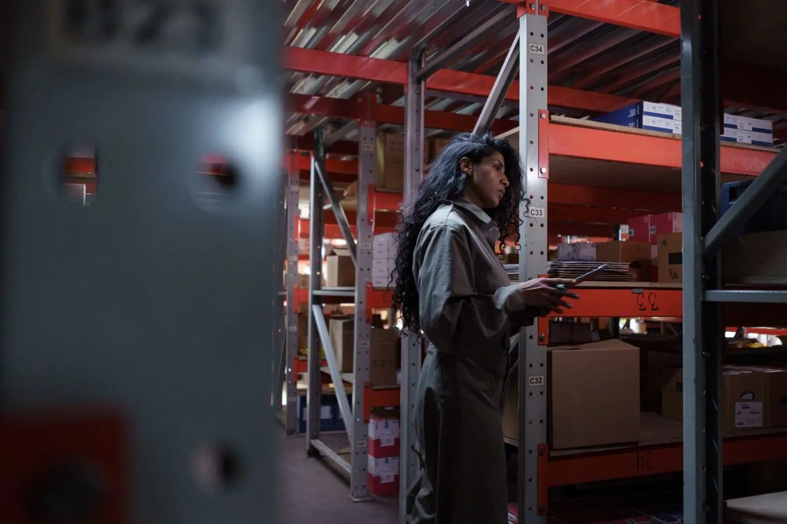 Technician inspecting a warehouse for rodent activity