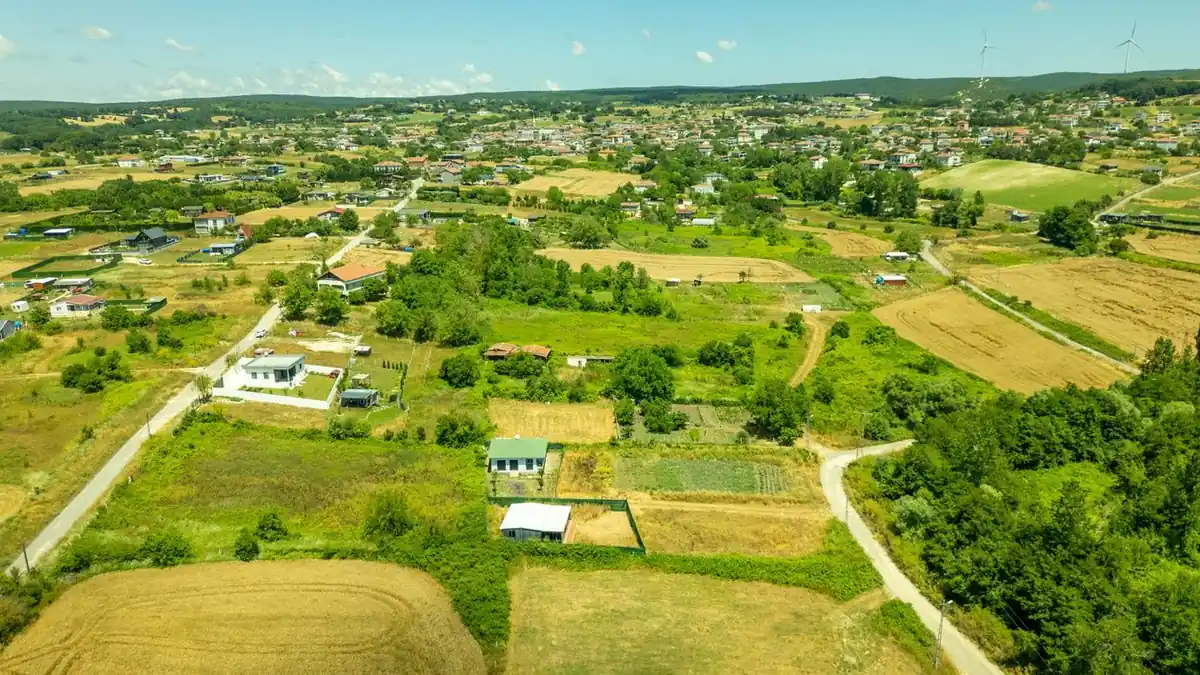 Aerial view of countryside homes and open land