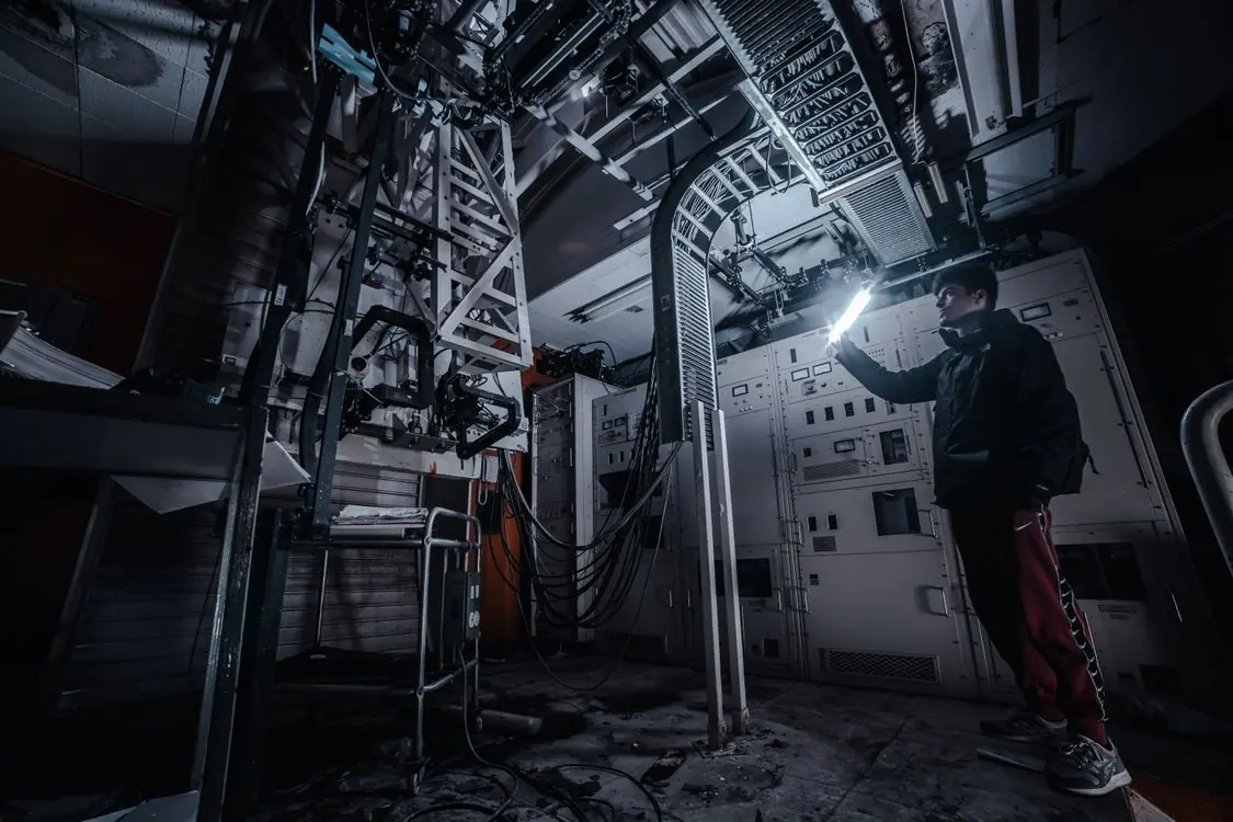 Technician inspecting a crawl space for rodent activity