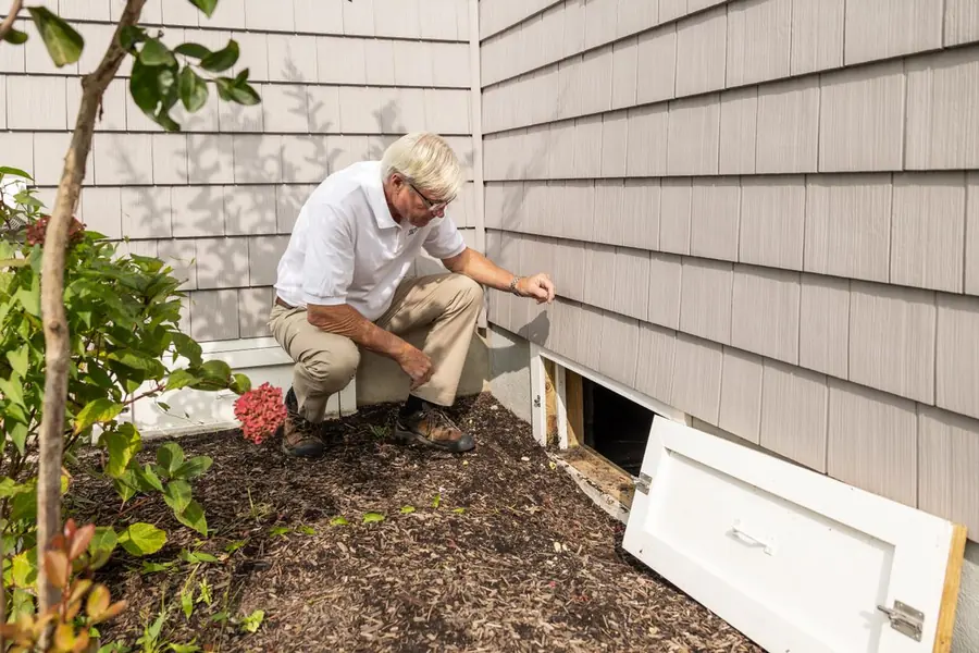Technician checking a monitoring point during a rat inspection