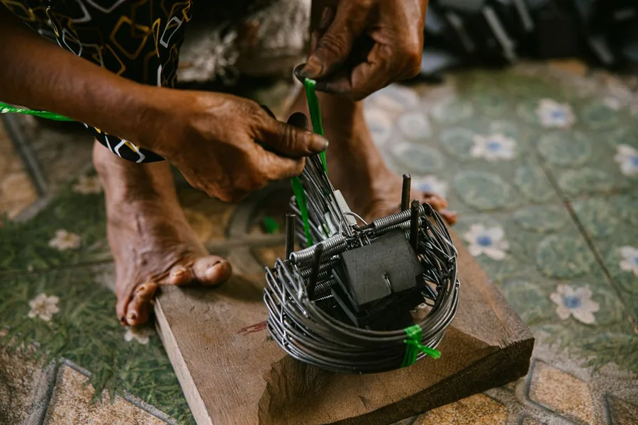 Technician setting a rat trap along an attic runway
