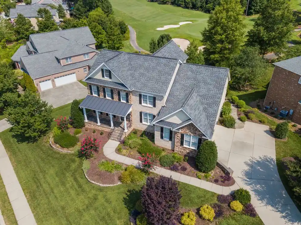 Home with a green lawn in Woodway, Texas
